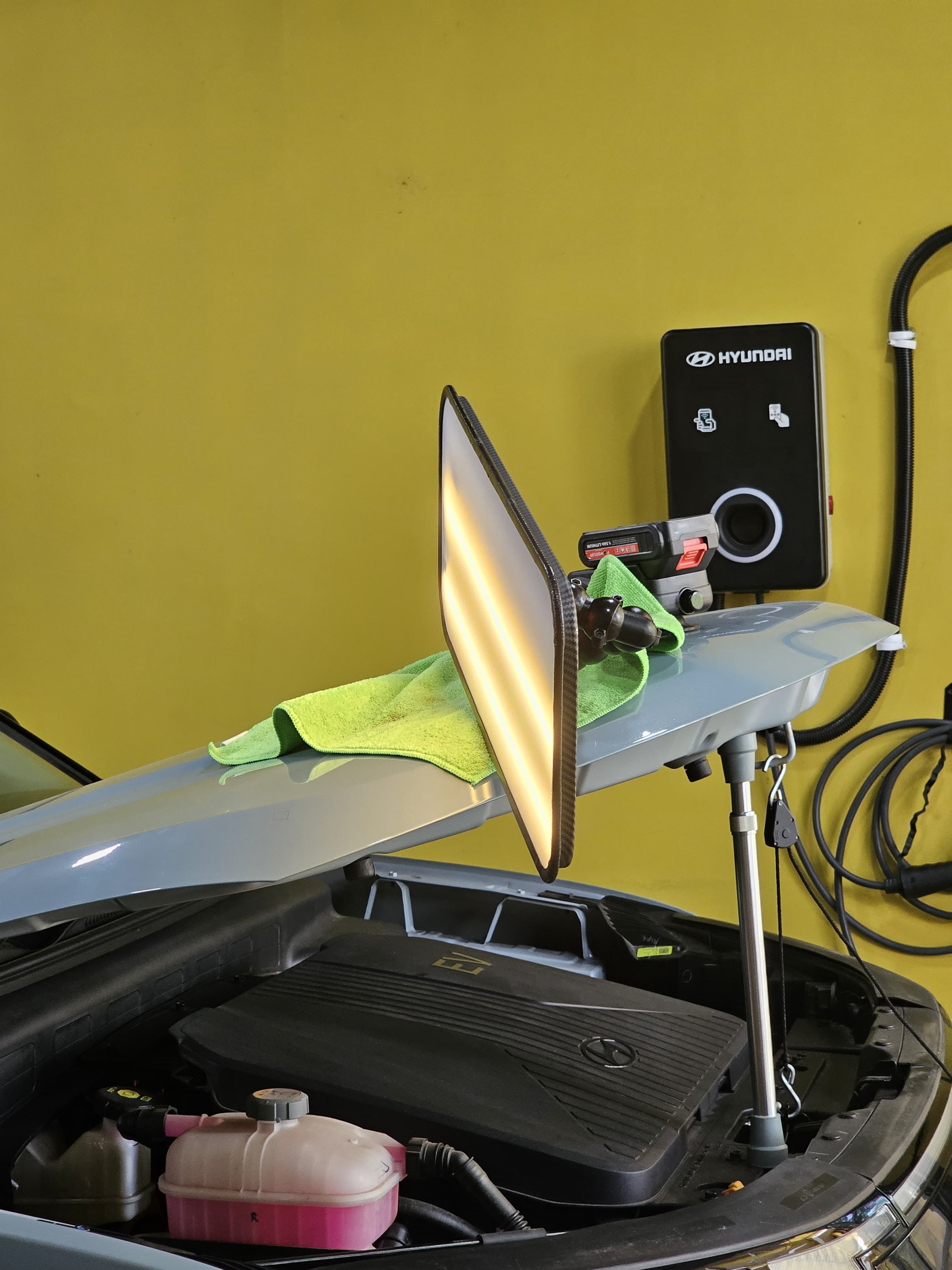 Hood dent repair in progress